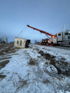 Heavy-duty recovery of an overturned semi-trailer by Diversified Towing and Recovery, LLC in Creston, IA.