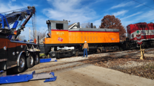 A heavy-duty tow truck from Elmquist Towing & Recovery preparing for a train locomotive recovery in Ames, IA.