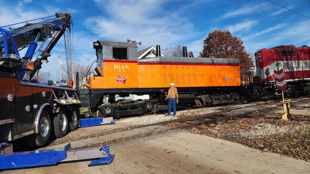 A heavy-duty tow truck from Elmquist Towing & Recovery preparing for a train locomotive recovery in Ames, IA.