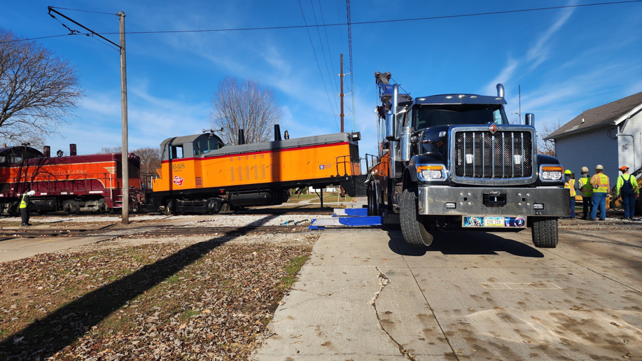 Elmquist Towing & Recovery performing heavy-duty recovery, lifting a train locomotive off tracks in Ames, IA.