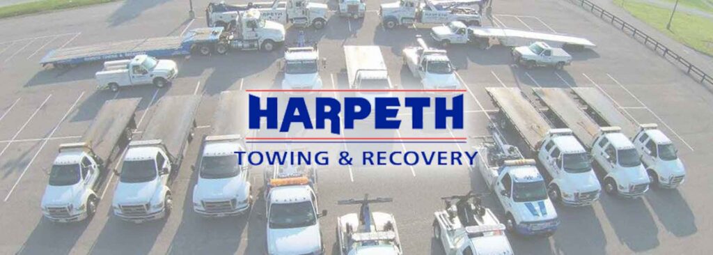 A heavy-duty wrecker truck from Harpeth Towing & Recovery on a job site in Franklin, TN.