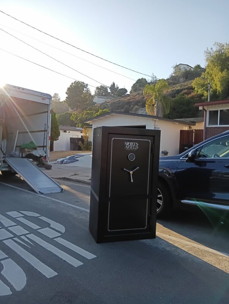 A heavy safe being moved from a residence onto a truck by Rough Çutt Movers in San Diego, CA