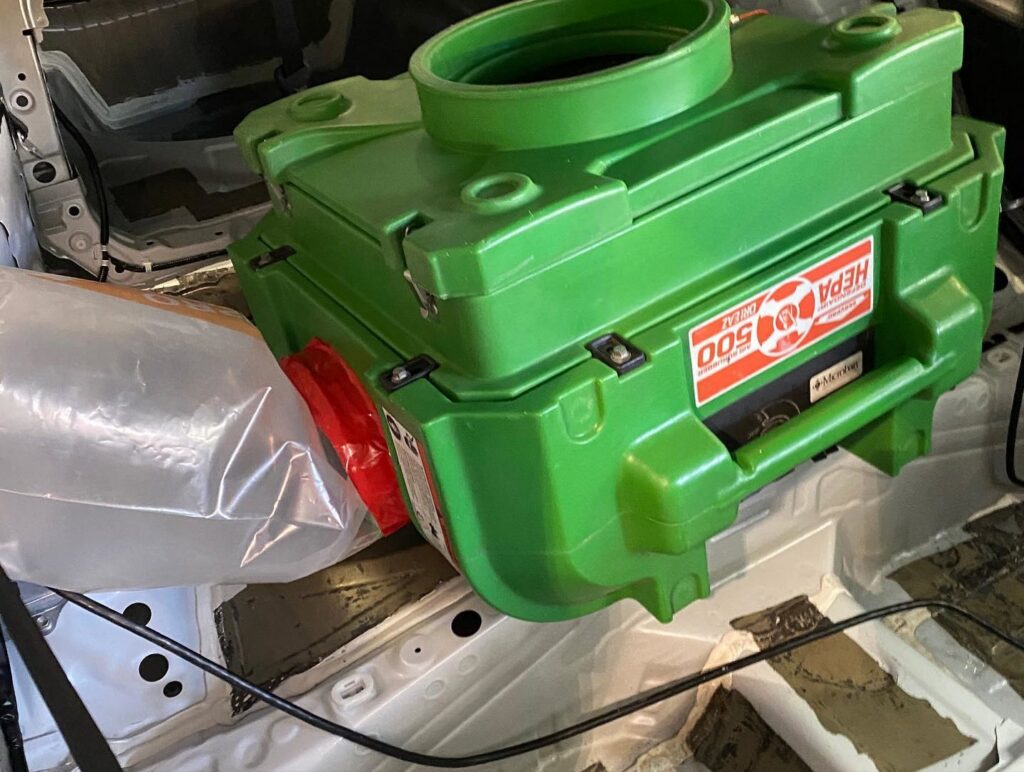 A HEPA air scrubber used for water damage restoration inside a car by Servpro of East Honolulu, HI.