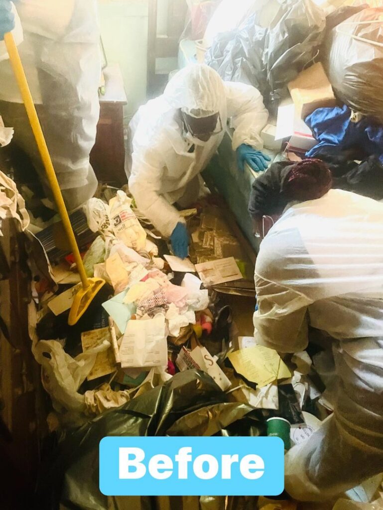 Professional cleaners in protective suits tackling a severe hoarding cleanup project for Skedaddle Cleaning Services in Eufaula, AL.