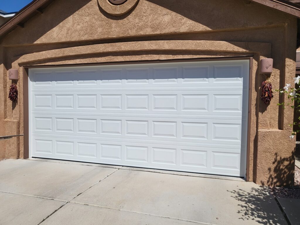 A new white horizontal panel garage door installed by Spartan Garage Doors and More in Albuquerque, NM.