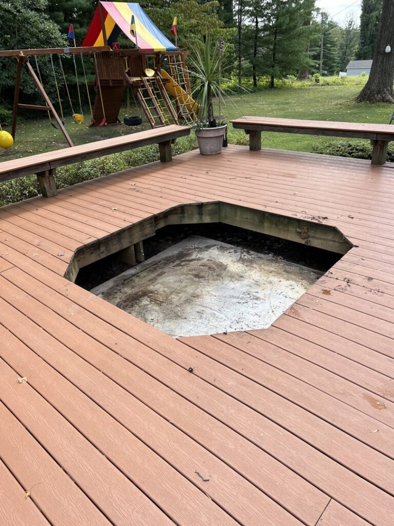 A wooden deck with a large opening after a hot tub removal by CYD Enterprises LLC in Philadelphia, PA