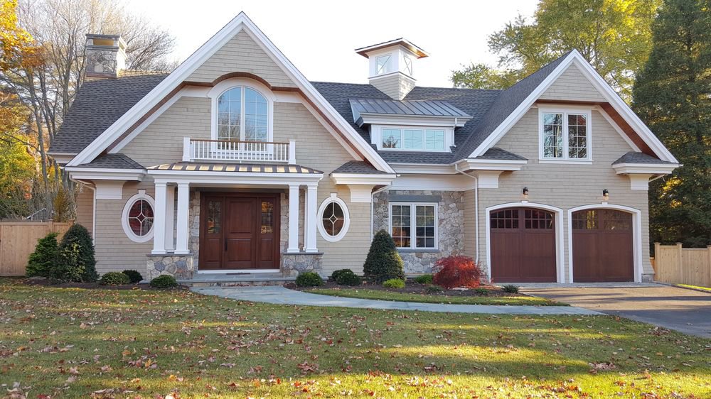 A charming house with new beige shingle siding and elegant stone accents, completed by JM Roofing & Siding in Rogers, AR.