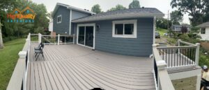 Residential home with new blue horizontal siding and a spacious deck by High Quality Exteriors in Rockville, MD.