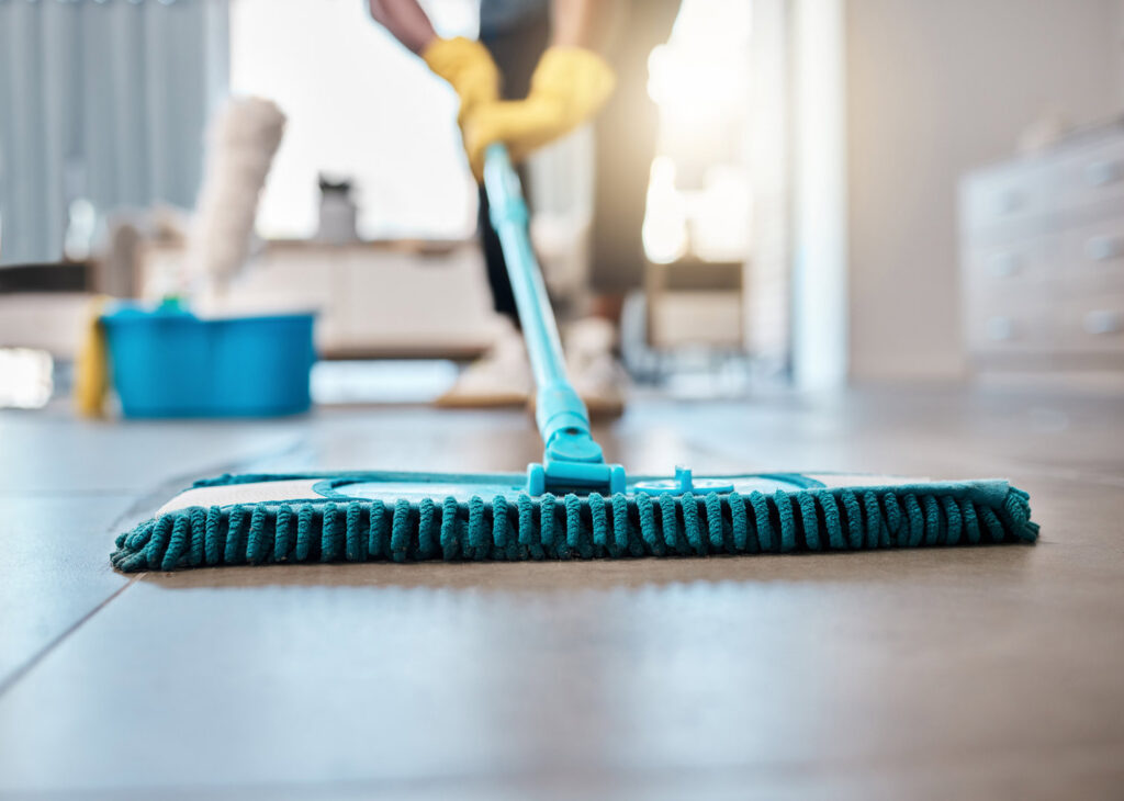 A house cleaner mopping a clean floor, representing Five Stars Cleaning Services in West Valley City, UT.