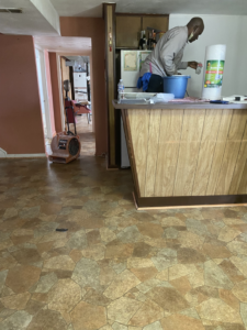 A house cleaner preparing cleaning supplies and equipment for a job by J&RD Cleaning Service LLC in Bowie, MD.