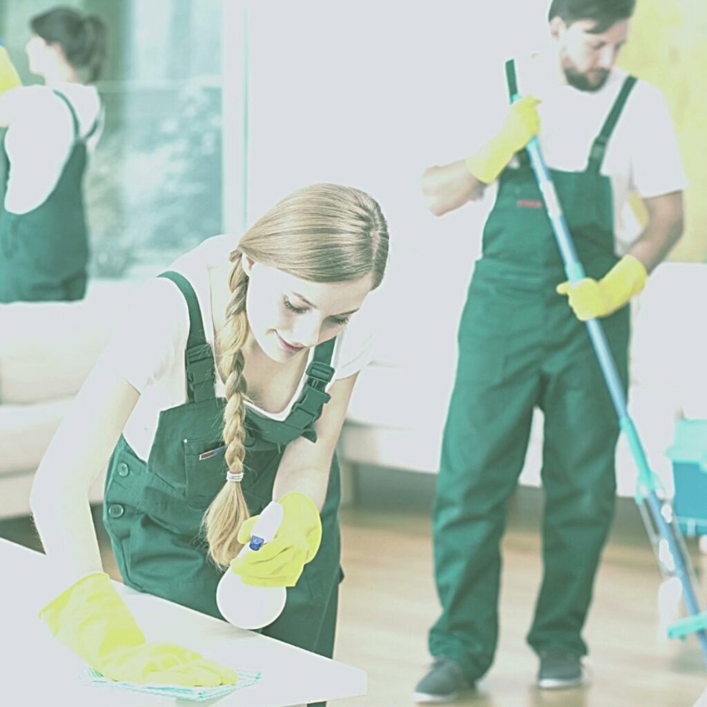 Two house cleaners from Eco Safe Clean wiping a surface and mopping a floor in Miami Beach, FL