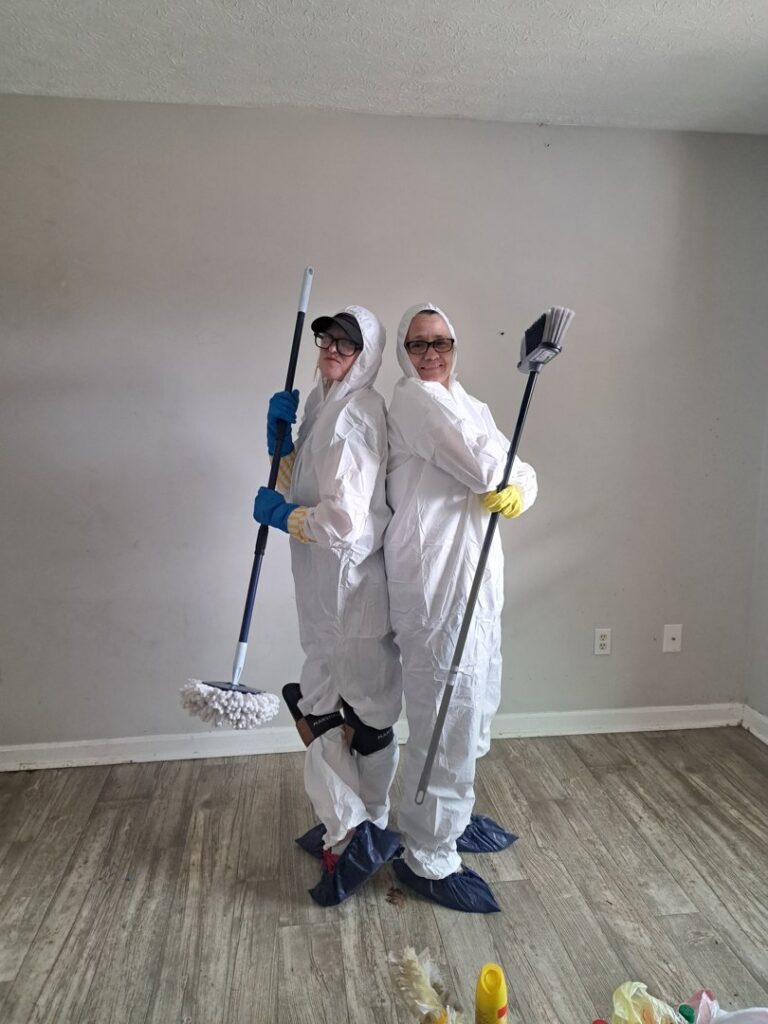 Professional house cleaners in protective gear holding mops and brooms, ready for a deep clean by Just Like Magic in Marina Del Rey, CA.