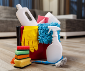 A collection of essential house cleaning supplies, including sponges, gloves, and spray bottles, used by Orange Cleaning Services in Stamford, CT.