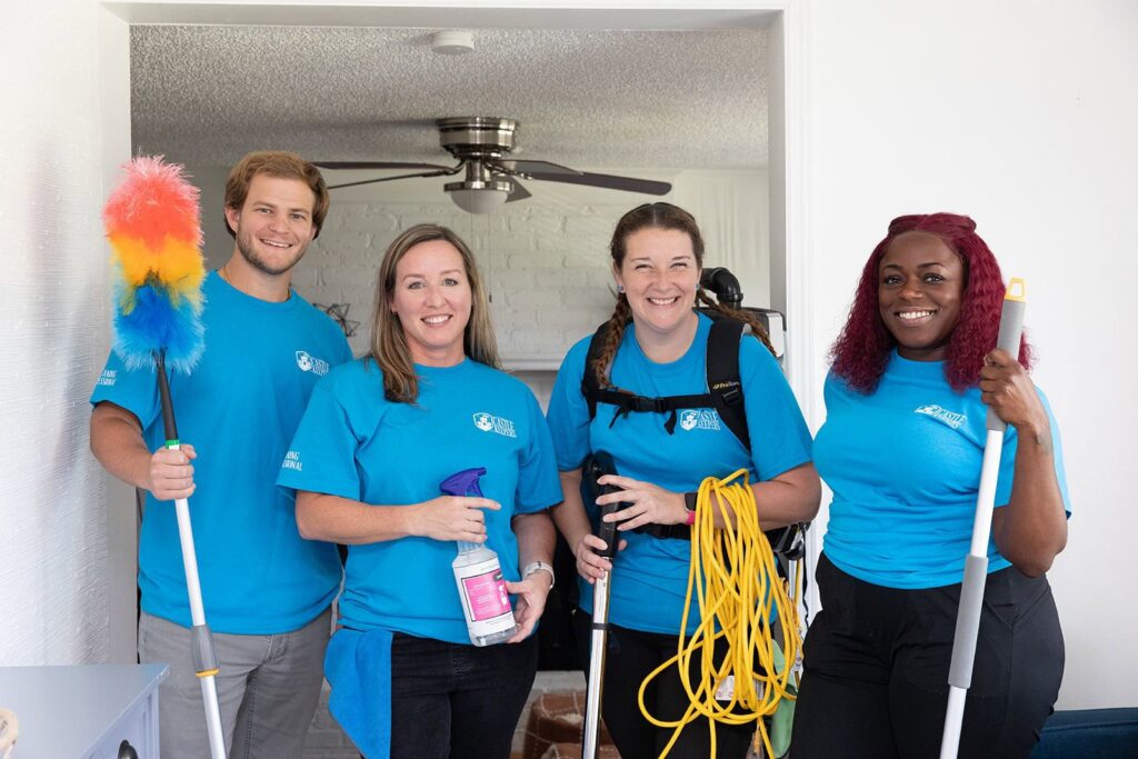 A professional house cleaning team from Castle Keepers House Cleaning, equipped with various tools, ready to work in North Charleston, SC.