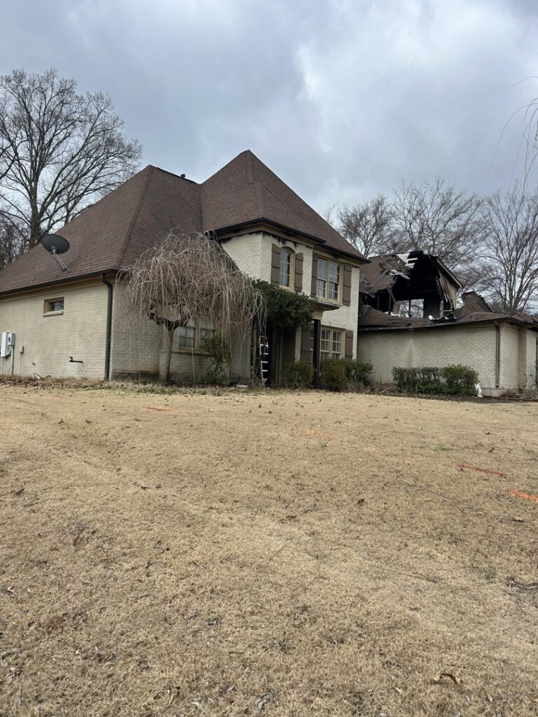 A house undergoing demolition with significant roof damage, handled by East Shelby Demolition & Pool Removal in Olive Branch, MS.