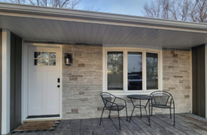 Front of a house showcasing stone veneer and vertical siding installed by D.A. Siding & Windows in Grand Island, NE.