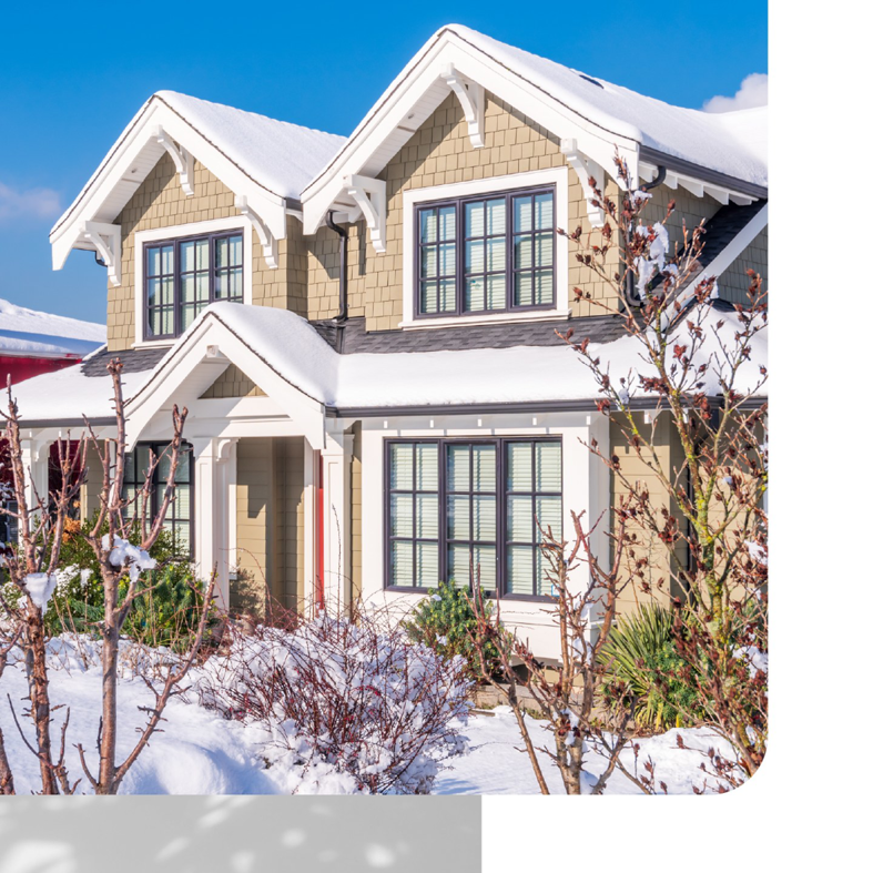 Beautiful house with tan shake siding and snow on the roof, a project by Southwestern Remodeling in Wichita, KS