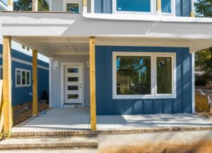 A house under construction with new blue vertical and horizontal siding installed by Ideal Siding Winston-Salem, NC.