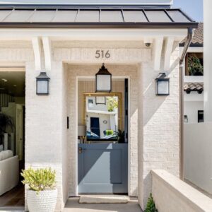 The front entrance of a house with modern white brick siding, showcasing work by Urban Exteriors LLC in Lakewood, CO.