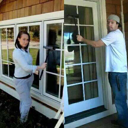 Two cleaners from Sister & Brother Cleaning Services professionally cleaning house windows in Sacramento, CA.