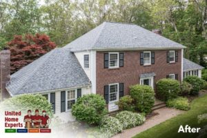 A beautiful house with new brick and white siding, showcasing a completed project by United Home Experts in Ashland, MA