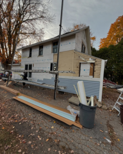 A house undergoing new siding installation by J&J Rivera Roofing and Supply Co in Old Saybrook, CT