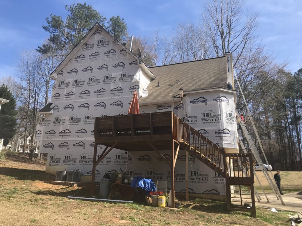 A house wrapped in HomeGuard house wrap, ready for new siding installation by HP Exteriors in Woodstock, GA