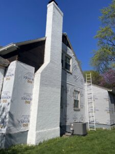 A house wrapped in house wrap, prepared for new siding installation by JHV Roofing in Scranton, PA.