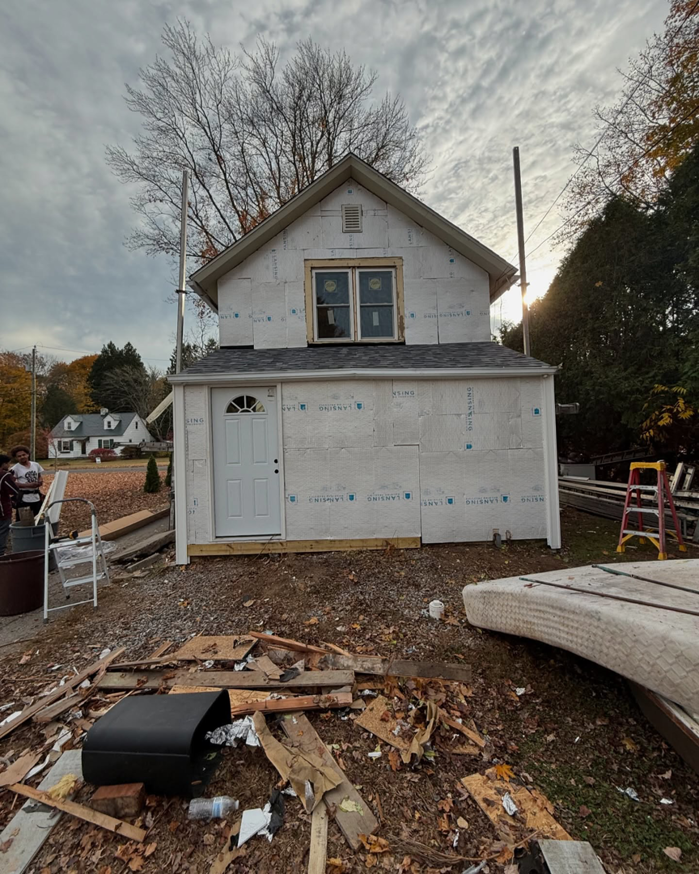 A house fully wrapped and prepared for siding installation by J&J Rivera Roofing and Supply Co in Old Saybrook, CT