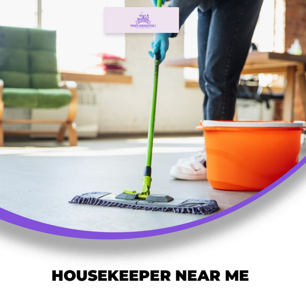 A housekeeper wearing gloves and mopping a floor with a flat mop for Hightower Private Housekeeping in Henderson, NV.
