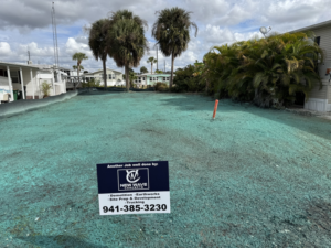 A newly hydroseeded lot after demolition and site preparation by New Wave Concepts in Cape Coral, FL.