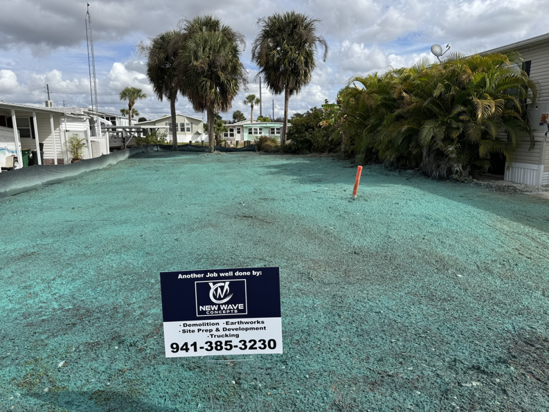 A newly hydroseeded lot after demolition and site preparation by New Wave Concepts in Cape Coral, FL.