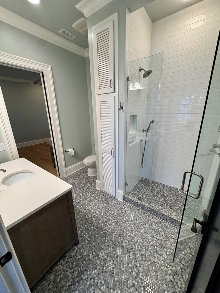 An immaculate bathroom featuring a sparkling walk-in shower and clean vanity, cleaned by Affordable Cleaning in North Charleston, SC.