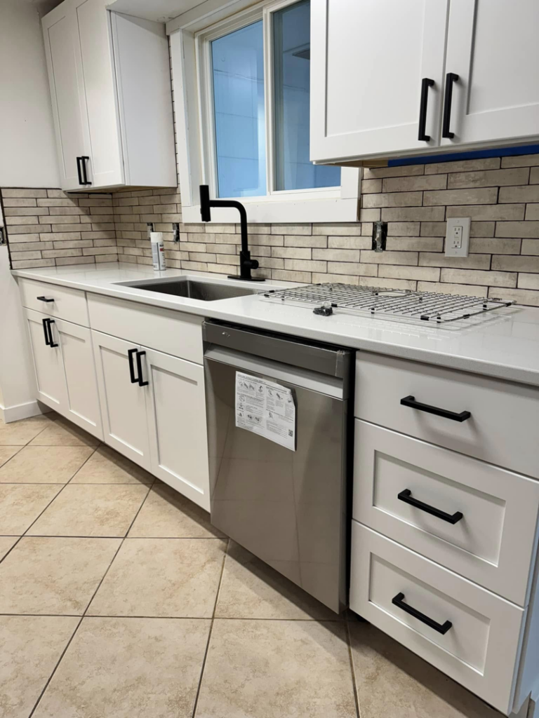 An immaculate kitchen featuring white cabinets and clean countertops, cleaned by Dust Detail Cleaning Services in Post Falls, ID.