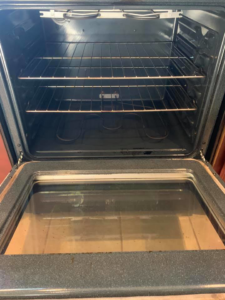 An immaculate oven interior with clean racks, showcasing the deep cleaning expertise of Remy the Cleaner in Indianapolis, IN.