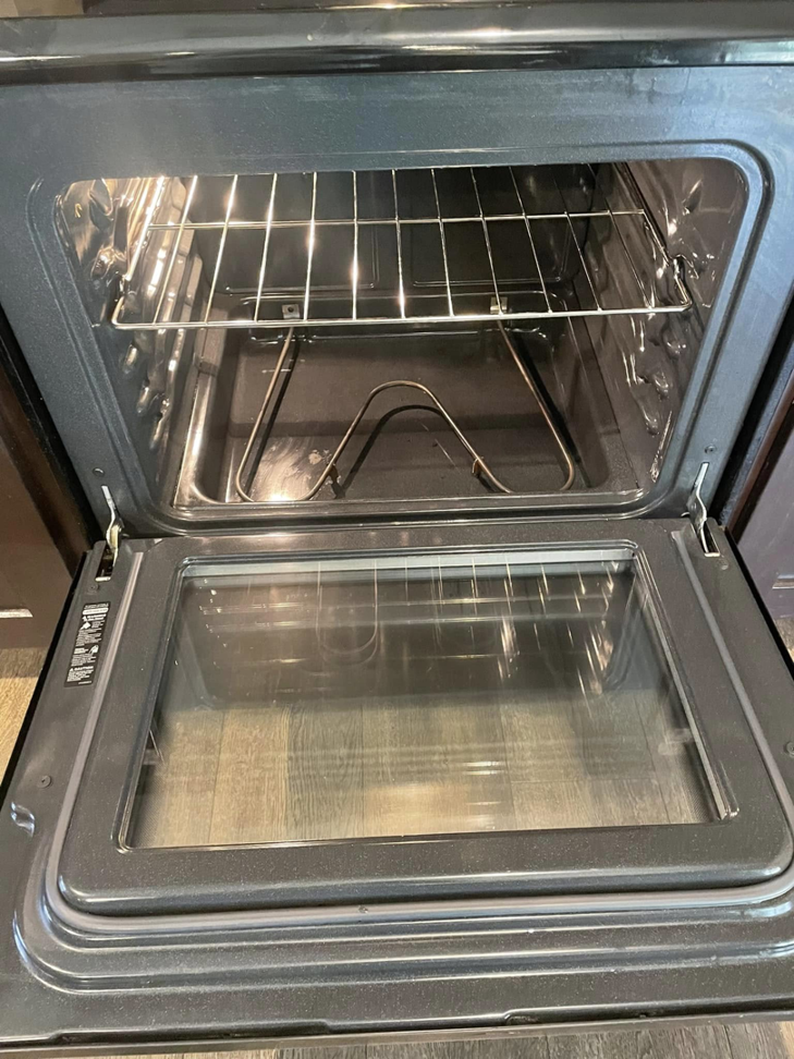 An immaculate and empty oven interior after professional deep cleaning by VM Residential cleaning LLC in Baton Rouge, LA.