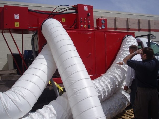 Large industrial drying equipment with ducts used for water damage restoration by USA Water Damage Thunder Restoration in Coon Rapids, MN.