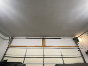 An inside view of a closed garage door, highlighting the installation and insulation by Bob McDonald Garage Door LLC in Columbus, NE.