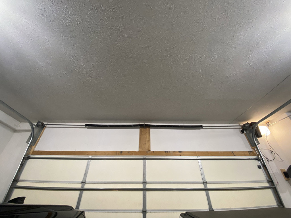 An inside view of a closed garage door, highlighting the installation and insulation by Bob McDonald Garage Door LLC in Columbus, NE.