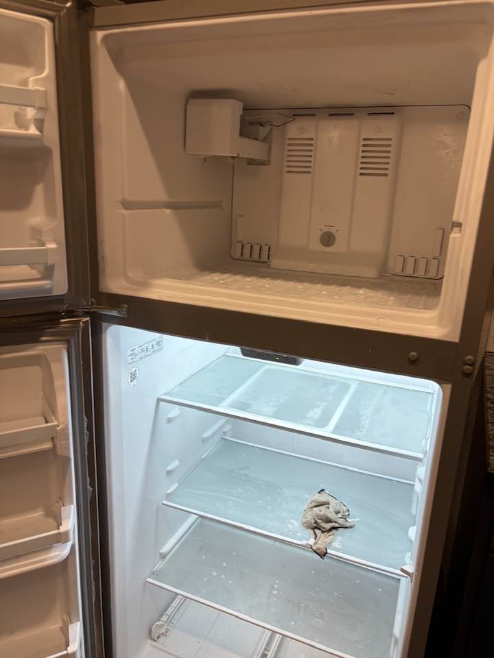 The sparkling clean interior of a refrigerator, a deep cleaning service offered by Jess Cleaning in San Antonio, TX.