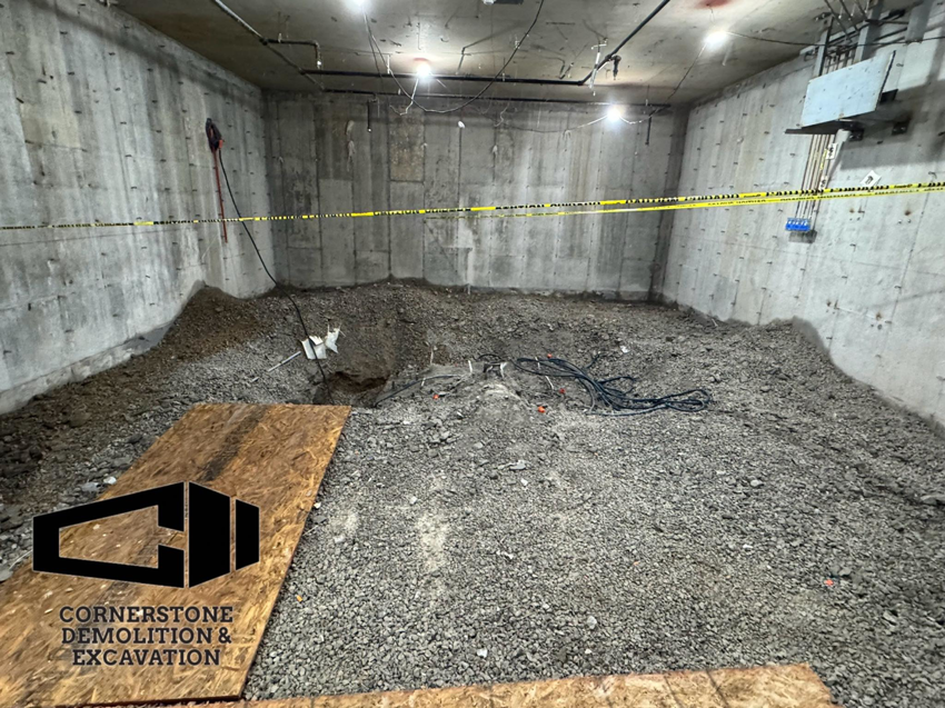 An interior demolition and excavation project in a concrete room by Cornerstone Demolition & Excavation in Lexington, KY