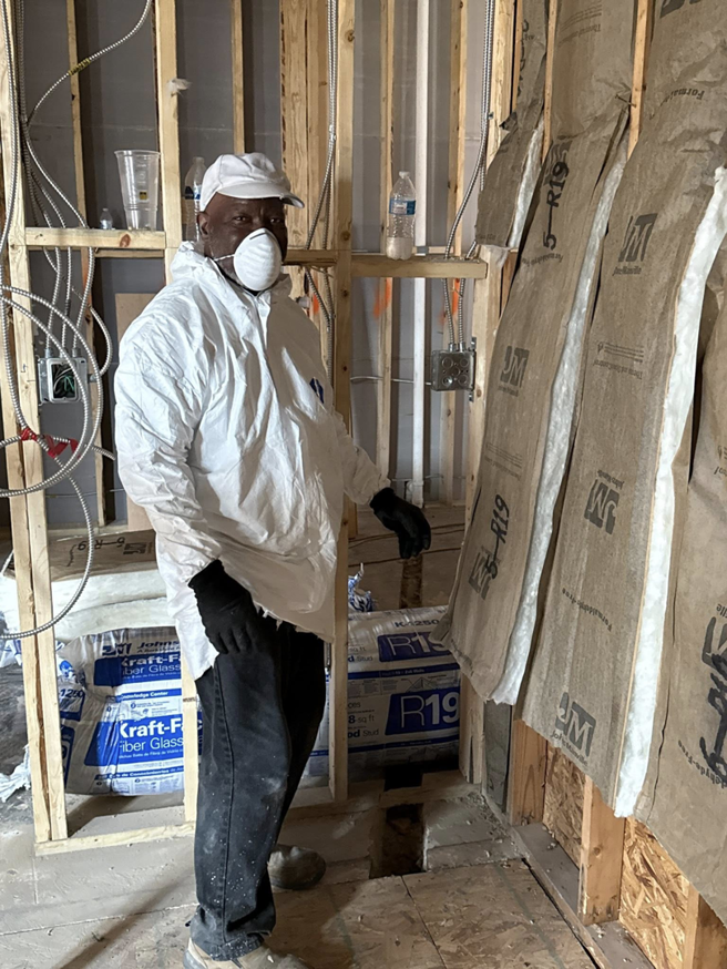 A worker in protective gear performing interior demolition for DM Construction Services in Bossier City, LA.