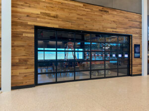An interior view of a large glass commercial garage door installed by Canyon Overhead Doors in Salt Lake City, UT.