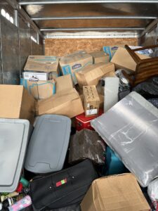 The interior of a Leaders Moving & Storage Co. truck, fully packed with boxes and household items in Indianapolis, IN.