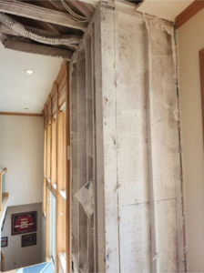 An interior wall stripped to studs during water damage repair by Advanced Recovery of the Midwest in Leavenworth, KS.