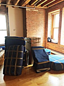 Household items wrapped in moving blankets and tape, ready for transport by Gifted Hands Moving & Storage in Collierville, TN.
