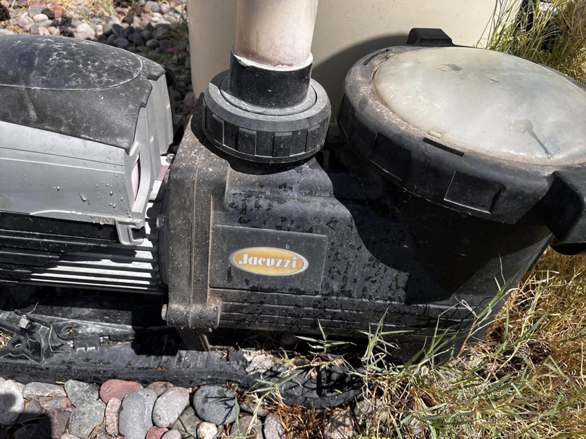 A Jacuzzi brand pool pump, indicating repair or maintenance services by Vegas Integrity Pool Service in Las Vegas, NV.