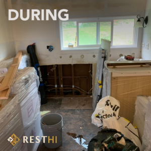 Exposed plumbing and removed cabinets during kitchen water damage restoration by Restoration Services Hawaii - RestHi in Honolulu, HI.