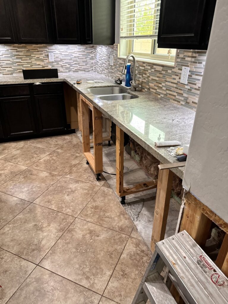 Kitchen demolition showing water damage and exposed framing by Western Skies Restoration in Gilbert, AZ.