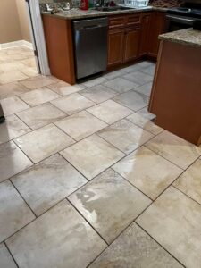 A clean kitchen tile floor, possibly after a professional cleaning service by Pile's Carpet Care & Restoration Service in Elizabethtown, KY.